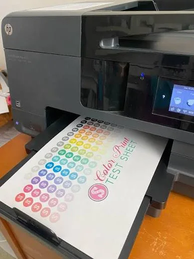 Photograph of a printer producing a color printer test sheet